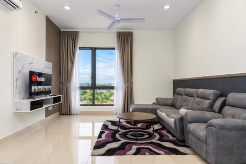 The bright & airy living area with a 3-seater couch.