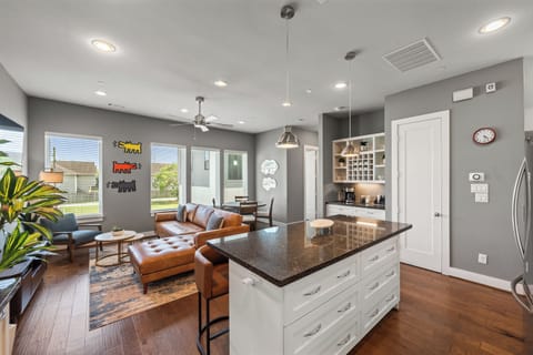 Bright open-concept living with stylish kitchen island and cozy lounge area