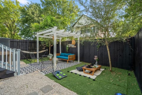 Lush green space, corn hole, and a water fountain—where relaxation and play come together.
