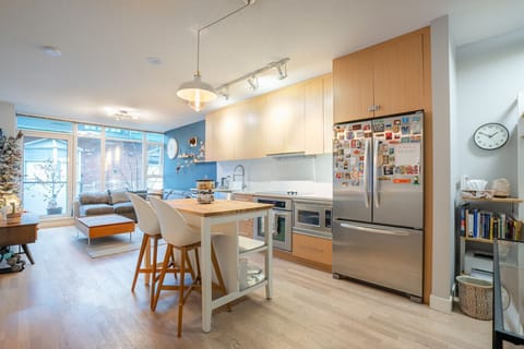 Open Concept Living: Sun-soaked dining and kitchen blend effortlessly with modern style!