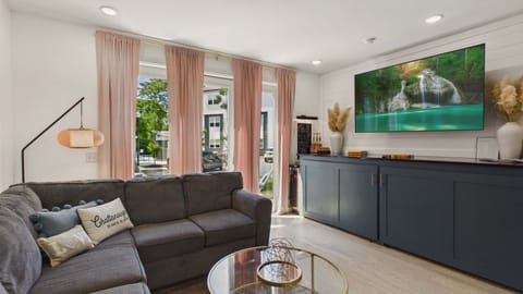 Living area with stylish furnishings and comfortable seating + TV