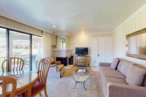 Settle into your Napa Valley retreat with a cozy fireplace, plush seating, and a private balcony overlooking the resort — perfect for unwinding after a day of wine tasting.