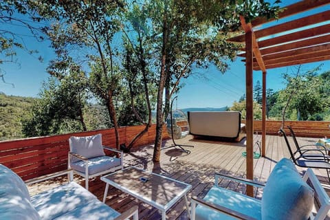 Kick back on your private hilltop deck where panoramic mountain views stretch across Sonoma wine country — your morning coffee spot just got an upgrade.