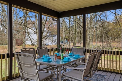 The screened-in porch was made for slow mornings and cozy evenings. Hammock naps, outdoor dining and fresh Pocono air included