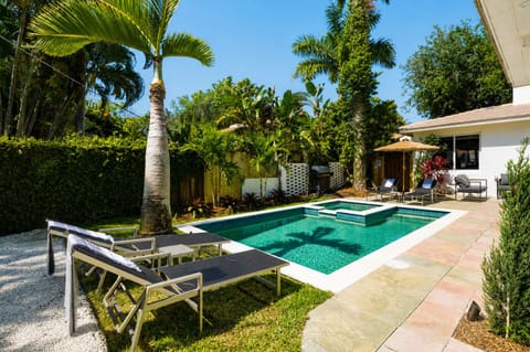 Luxury outdoor pool with tropical vibes and palm views
