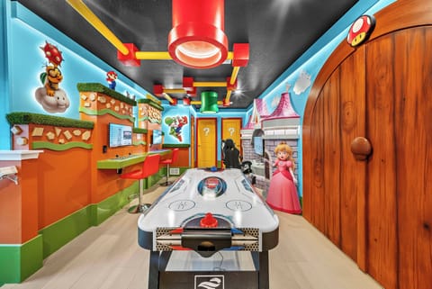 Step into a vibrant world of playful decor and friendly competition at the air hockey table. Enjoy charming character murals and delightful lighting that create a fun atmosphere for guests of all ages.