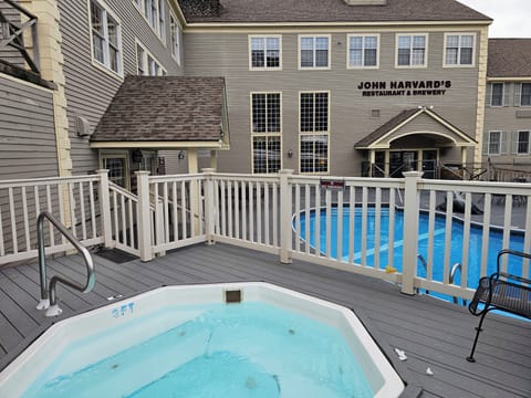outdoor spa tub and heated pool