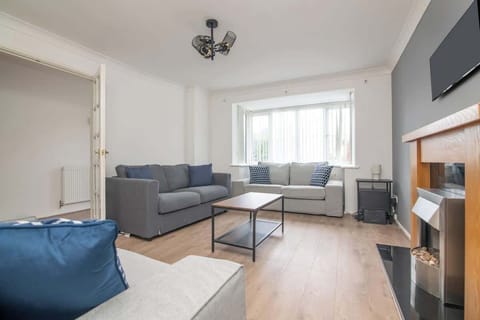Living Room: Bright and airy retreat with modern decor, plush sofas, and inviting fireplace ambiance!