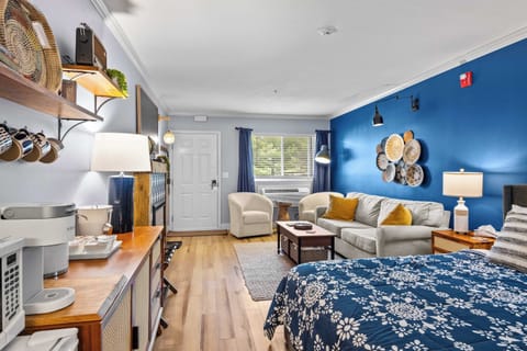Bright, beautifully styled retreat with a queen bed, full living space, and kitchenette. Sleeps 4 with the queen sleeper sofa.