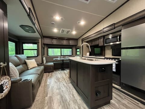 Open living and kitchen space at The Mountain Nook RV retreat in Townsend, Tennessee