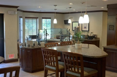 Start your day right in a welcoming breakfast area filled with natural light.