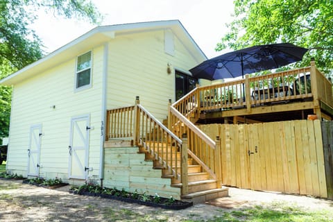 Private entrance with spacious deck, fenced yard and outdoor seating