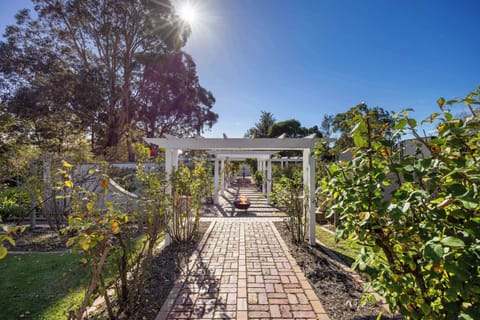 The enchanting rose garden, with fire pit and water feature