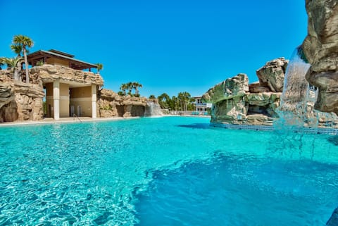 Welcome Home! Enjoy a peaceful family getaway with a huge neighborhood pool, only a short golf cart ride from the beach!