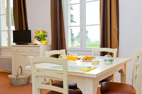 Start your mornings at the dining table with fresh pastries and views of the Norman countryside