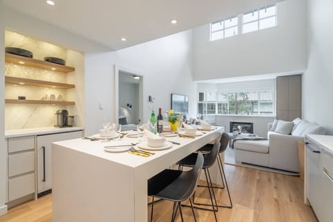 Indulge in our dining area for 6, complete with a coffee bar offering Organic Coffee, Tea and Nespresso pods. Enhance your experience with the added bonus of a separate wine fridge.