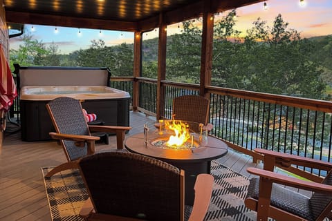 Soak in the private hot tub or gather by the fire pit surrounded by Ozark trees.