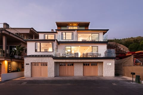 Newly remodeled three-story oceanfront home with garage parking for three vehicles.