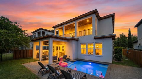 The kind of evening that makes you never want to leave — private heated pool, outdoor kitchen, second-floor deck, and a 30A sunset to top it all off