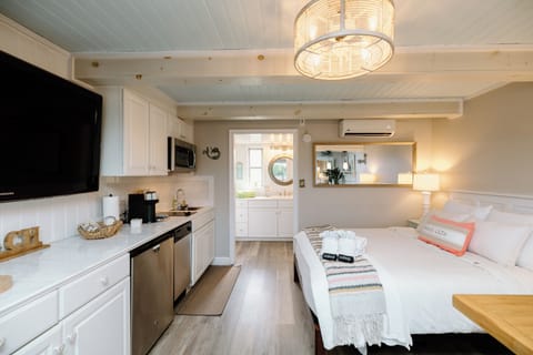 Relax after a beach day in the comfortable living space featuring lounge seating, high-speed Wi-Fi, and a large Smart TV with streaming services.