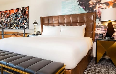 Drift off beneath bold art and a cushy headboard.
