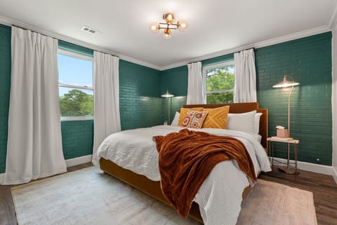 King bed, high end mattress and linens, and blackout curtains.
