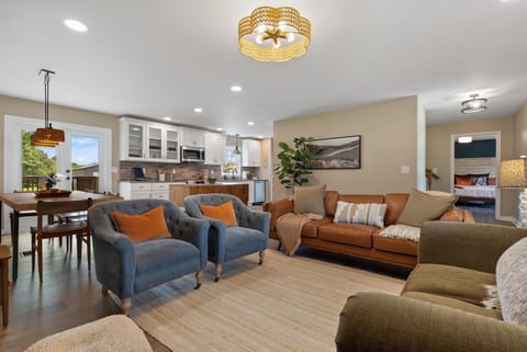 Our comfortable living room; adjacent to the dining room and kitchen, perfect for hosting and reconnecting.