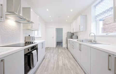 Bright modern kitchen with sleek appliances and spacious clean design