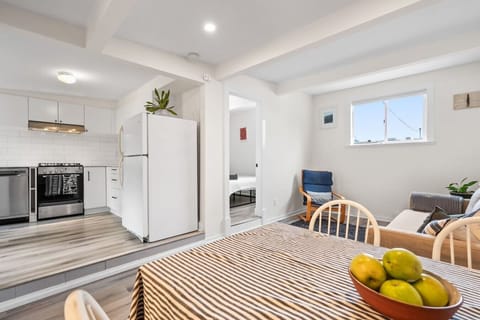 Living Room: Sunlit spaces perfect for relaxation or dinner with friends await!