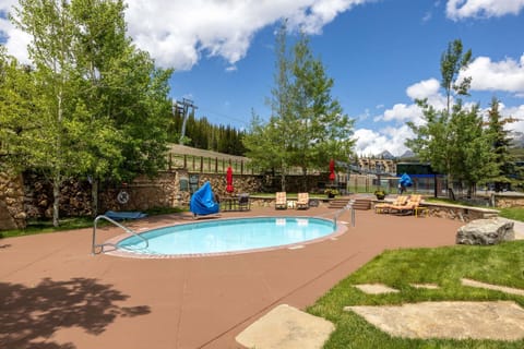 Outdoor community pool and hot tub, summer's best excuse to stay outside all day, winter's best reason to come back for a soak