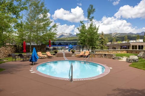 Outdoor community pool and hot tub, summer's best excuse to stay outside all day, winter's best reason to come back for a soak