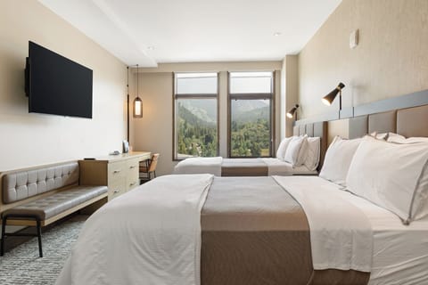 Unwind in this double-queen bedroom with a Smart TV—comfort and entertainment in one.