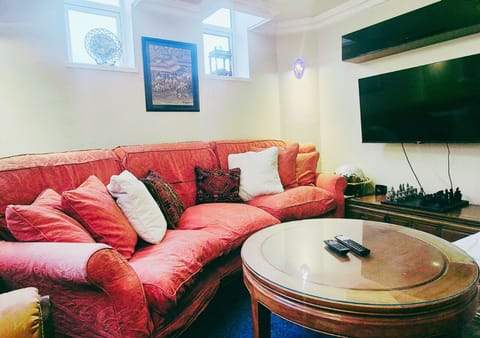 Living room: Comfy seating area with Smart TV
