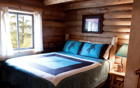 Cowboy Cabin main level bed