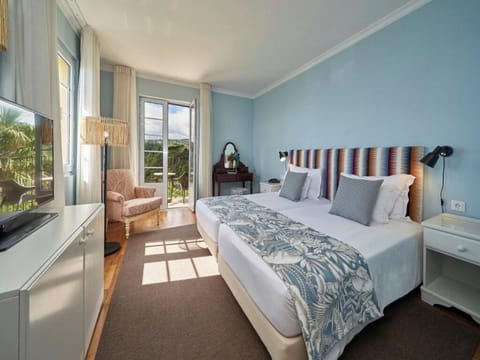 Wake up to sunlight and views from this serene bedroom.