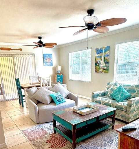 Open concept living and dining area.  58" TV not shown