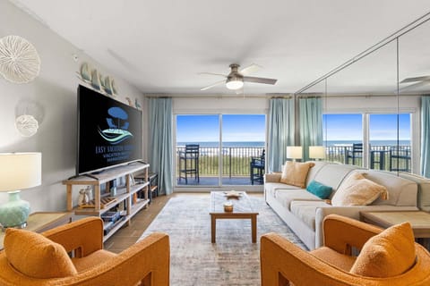 Open living room, queen sleeper sofa, with direct access to the large balcony.