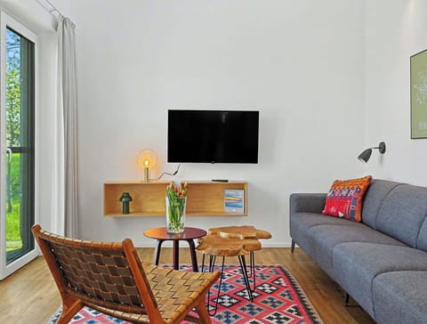 Furniture, Interior Design, Flooring, Couch, Wall, Floor, Living Room, Wood, Table, Room