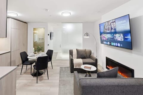Cozy living room with Smart TV, fireplace, and comfortable seating