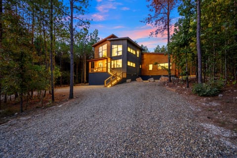 Modern luxury cabin tucked into 1.2 acres of peaceful pines.
