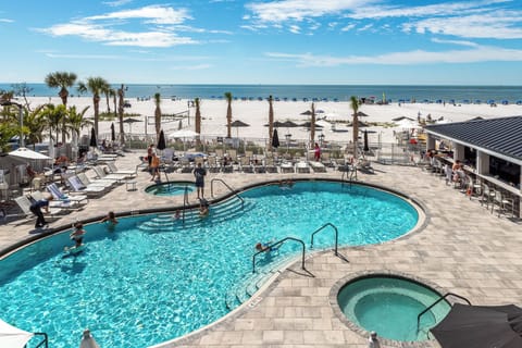 Dive into sparkling pool days steps from the beach.