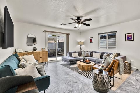 Bright modern living room with patio access and oversized sectional