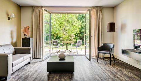 Sip morning coffee as doors open to lush greenery.