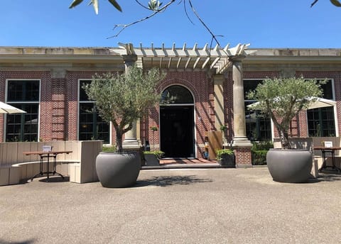 Sip coffee outside and linger by the elegant entryway.