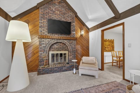 Cozy fireplace lounge with rustic accents and comfortable seating.
