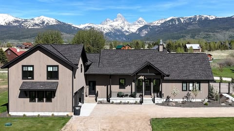 Modern mountain retreat with stunning snow-capped peak views
