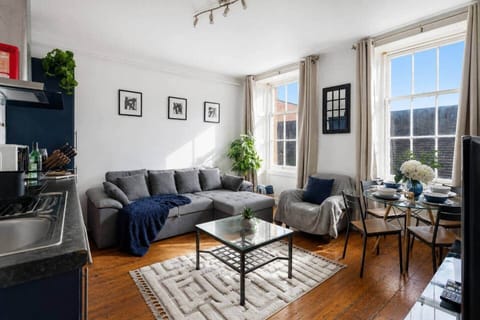 Bright and spacious living area with large windows and plenty of natural light