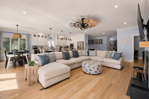 Gather the whole group here, with the kitchen and dining table just steps away.