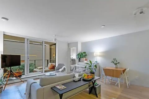 Living Room: Bright and airy space with garden views and stylish furnishings for relaxation!
