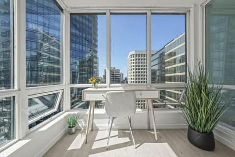 Sunlit Office Retreat: Inspiring city views from your bright, serene workspace in Vancouver!